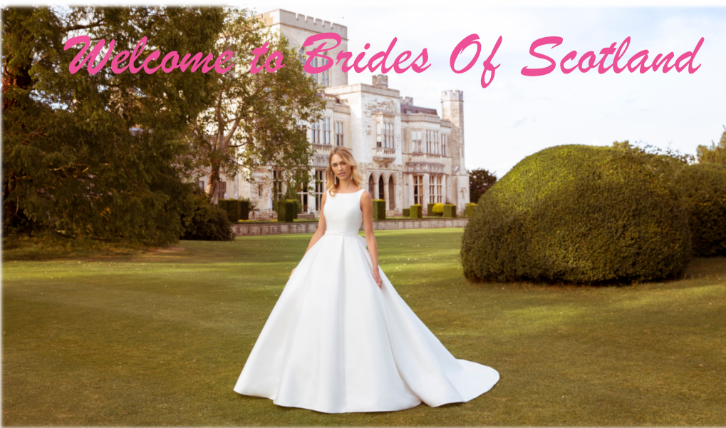Bride in a bridal dress in front of a castle.